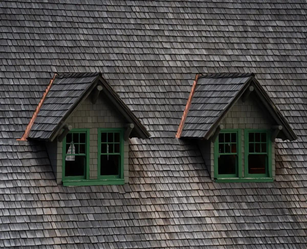 Dormers on a shingle roof in West Jordan, UT, where step flashing and kickout flashing carry water past the walls