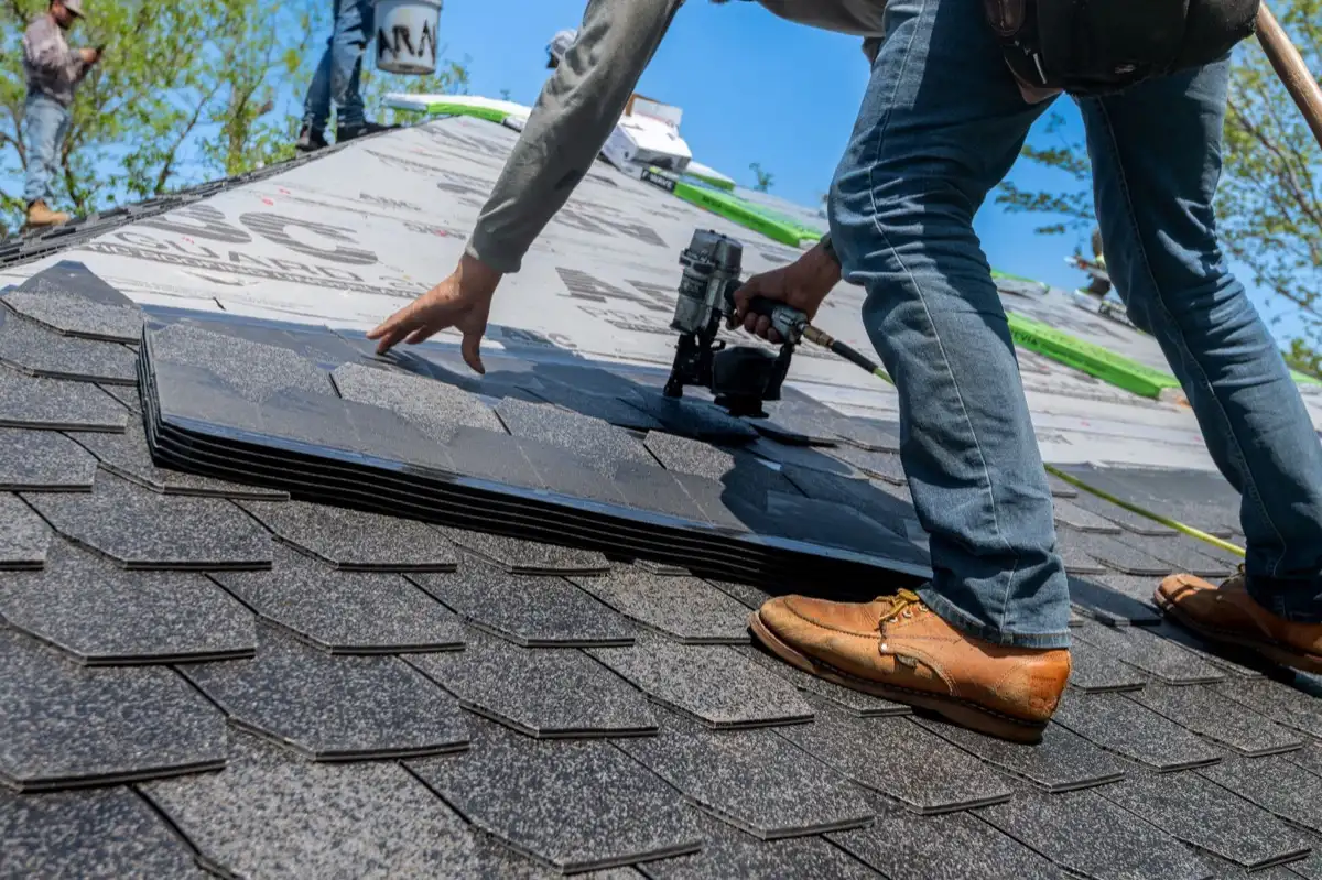 Inspecting an asphalt shingle slope after a hailstorm in West Jordan, UT